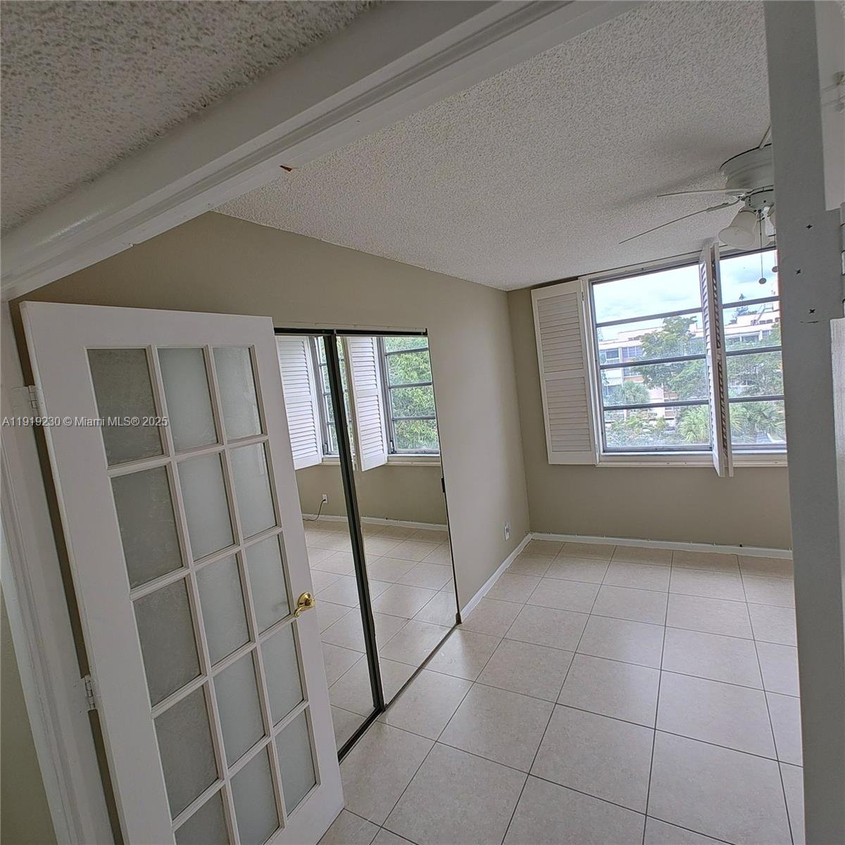 7051 Environ Boulevard, Unit 433 Lauderhill, FL 33319 - Photo 23 of 36 a view of an empty room with glass door