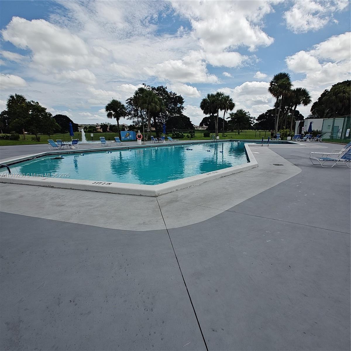 7051 Environ Boulevard, Unit 433 Lauderhill, FL 33319 - Photo 35 of 36 a view of a swimming pool and a yard