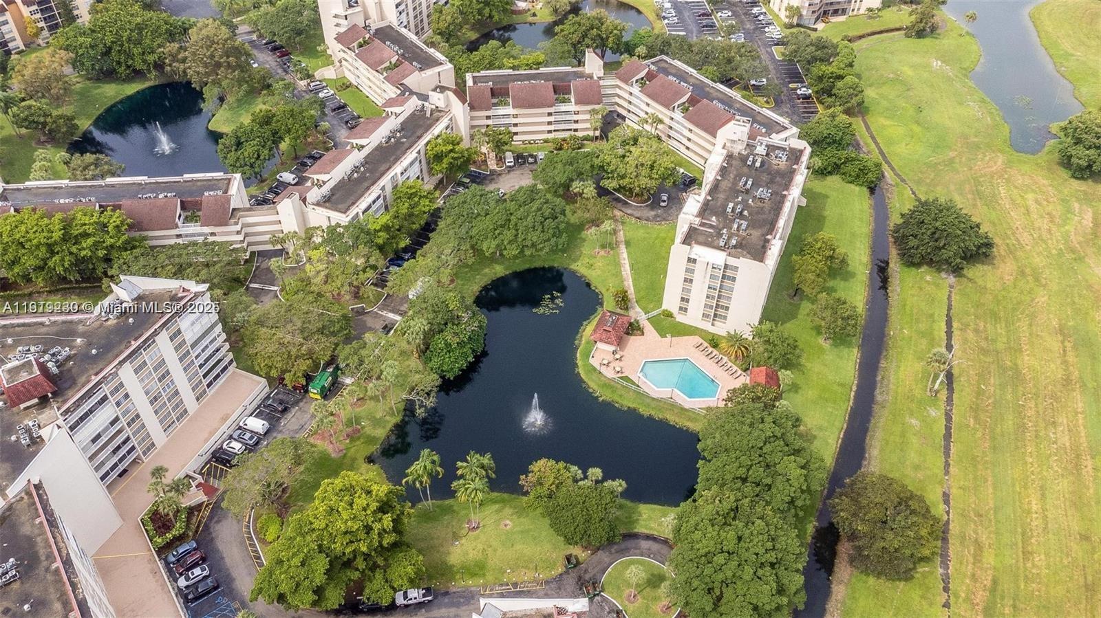 7051 Environ Boulevard, Unit 433 Lauderhill, FL 33319 - Photo 4 of 36 an aerial view of a house with a yard and garden