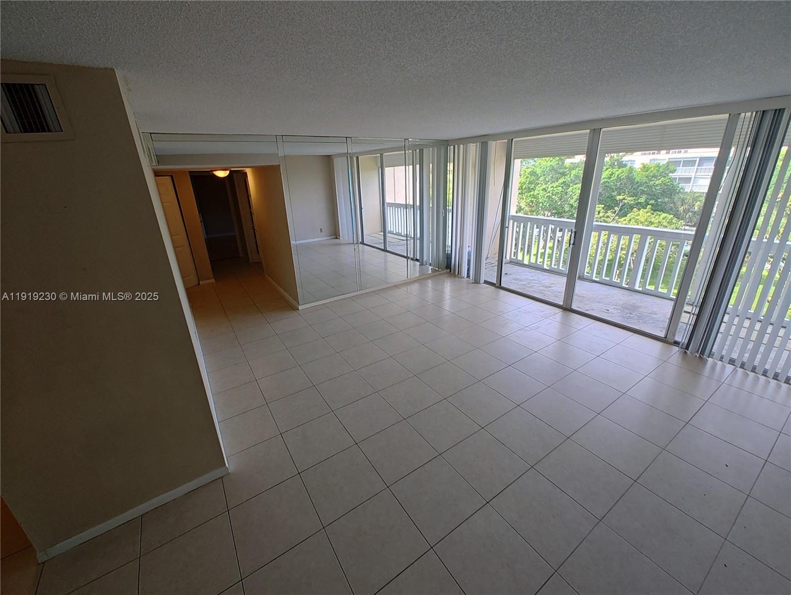 7051 Environ Boulevard, Unit 433 Lauderhill, FL 33319 - Photo 5 of 36 a view of an empty room with a window