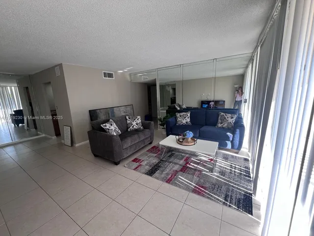 a view of an empty room with glass door