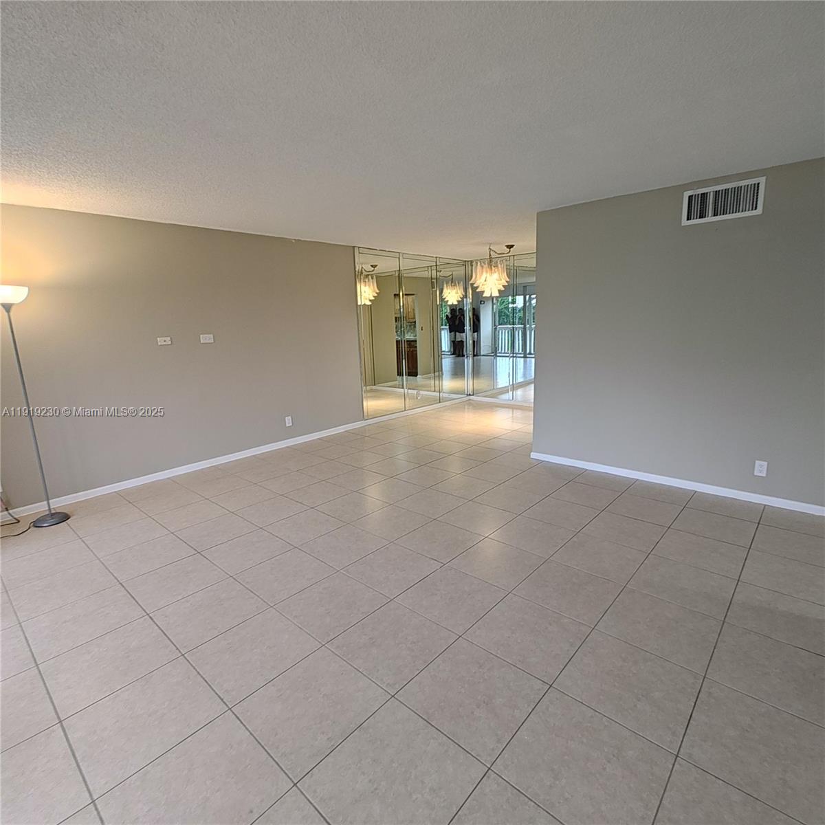 7051 Environ Boulevard, Unit 433 Lauderhill, FL 33319 - Photo 9 of 36 a view of an empty room with glass door