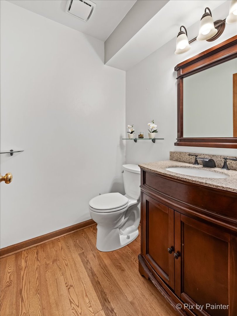 562 Boardman Circle Bolingbrook, IL 60440 - Photo 17 of 47 a bathroom with a toilet sink and mirror