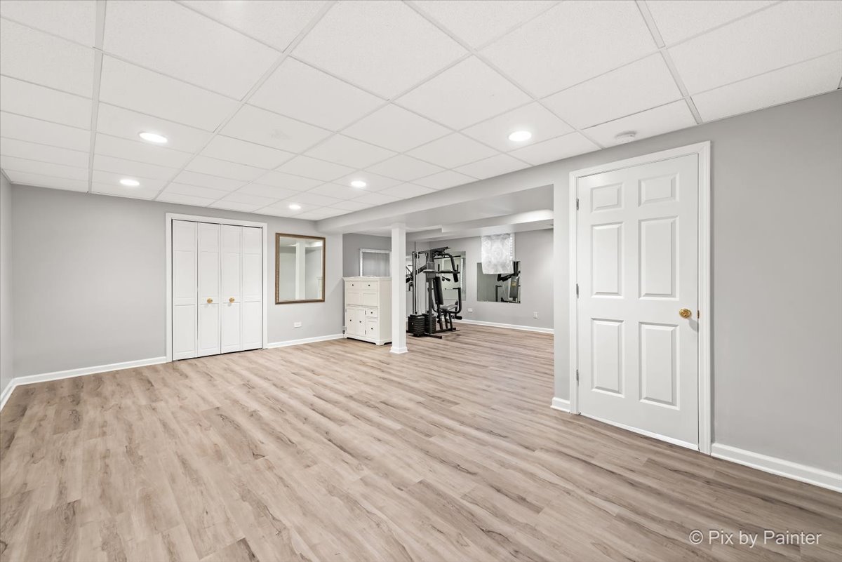 562 Boardman Circle Bolingbrook, IL 60440 - Photo 19 of 47 a view of empty room with wooden floor