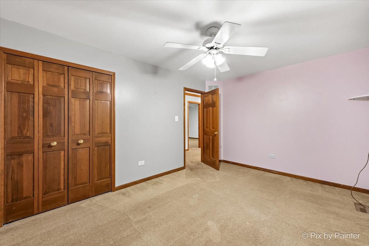 562 Boardman Circle Bolingbrook, IL 60440 - Photo 27 of 47 an empty room with closet and a chandelier fan