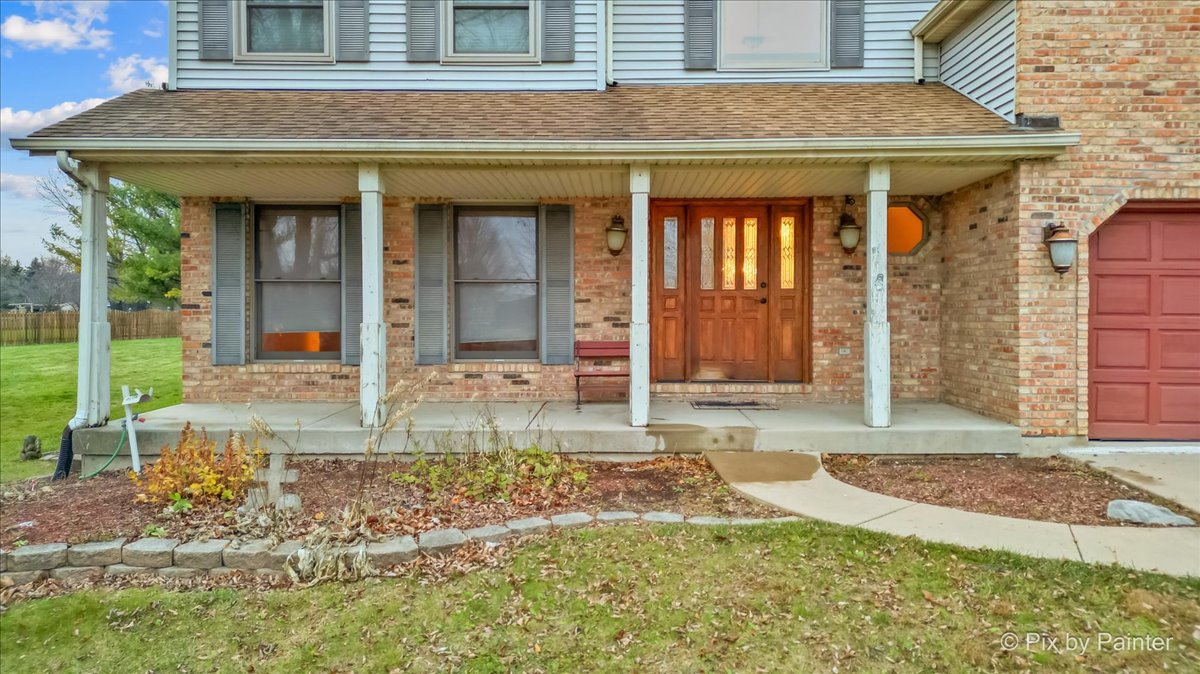 562 Boardman Circle Bolingbrook, IL 60440 - Photo 39 of 47 a view of a house with small yard plants and large tree