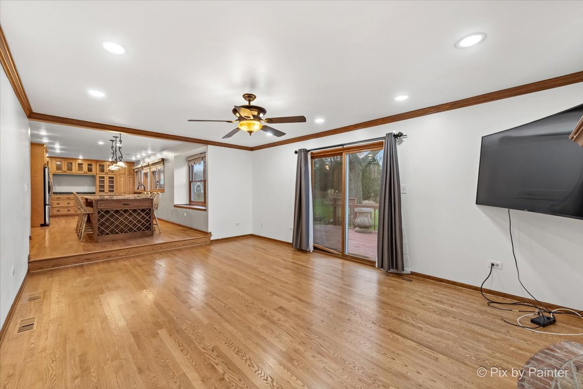 562 Boardman Circle Bolingbrook, IL 60440 - Photo 9 of 47 a view of an empty room with wooden floor