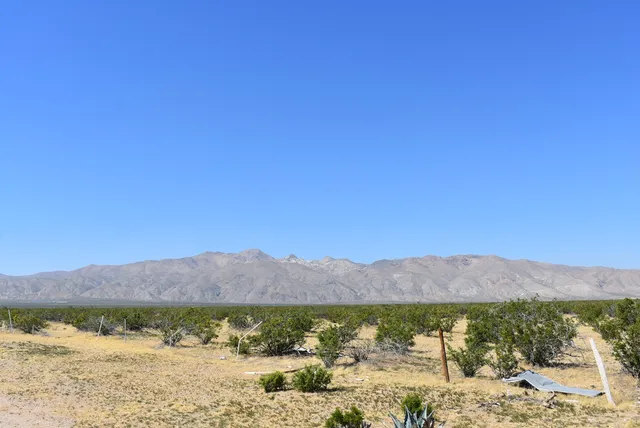 a view of an ocean with a mountain