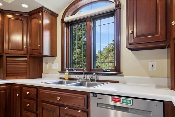 a kitchen with a sink and a window