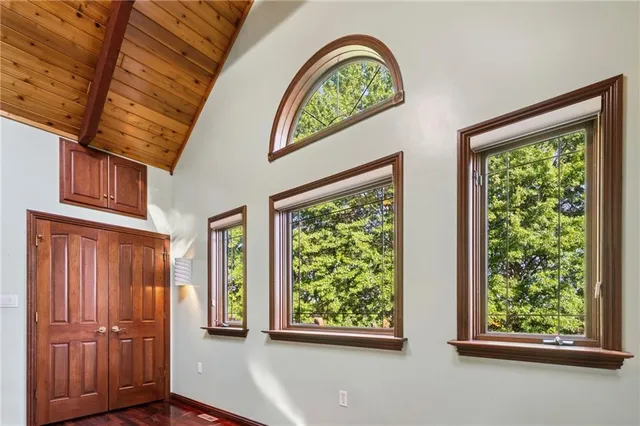 a spacious bathroom with a double vanity sink and a large mirror