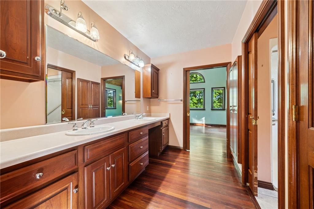 260 Jennie Drive Irwin, PA 15642 - Photo 26 of 49 a spacious bathroom with a double vanity sink and a large mirror