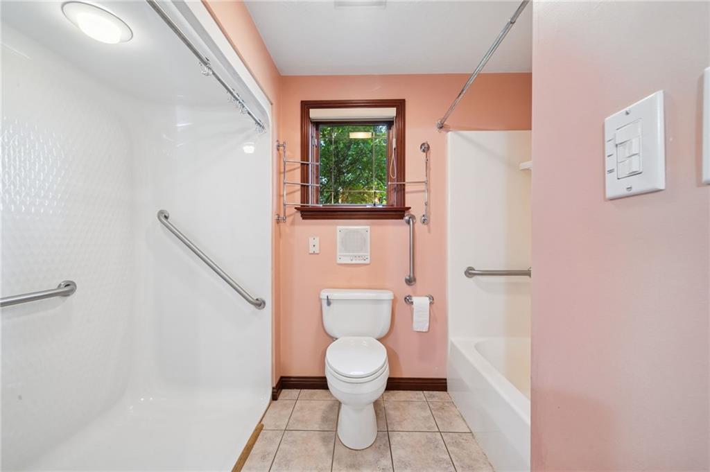 260 Jennie Drive Irwin, PA 15642 - Photo 27 of 49 a bathroom with a toilet a window and a shower