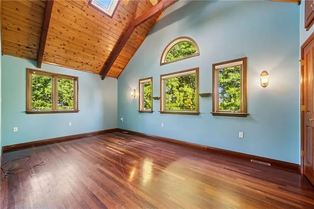 a view of an entryway with wooden floor