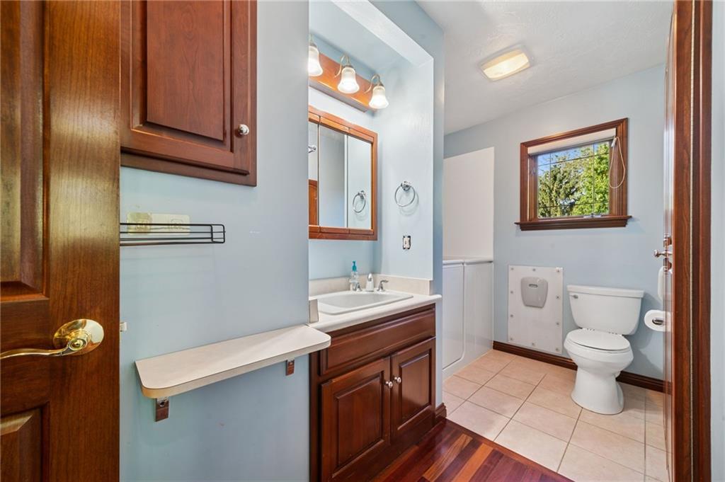 260 Jennie Drive Irwin, PA 15642 - Photo 32 of 49 a bathroom with a sink a toilet and mirror
