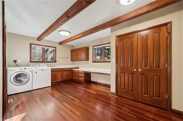 a view of a kitchen with a sink and cabinets