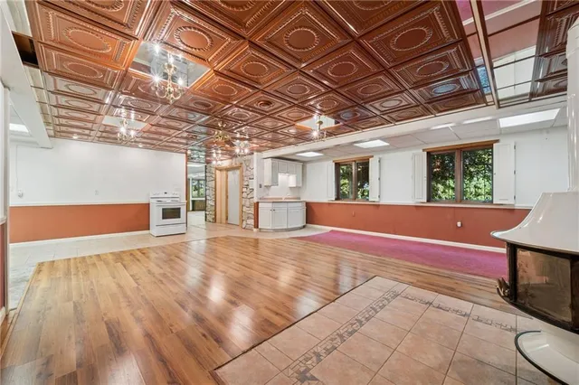 a bathroom with a granite countertop sink mirror and bathtub
