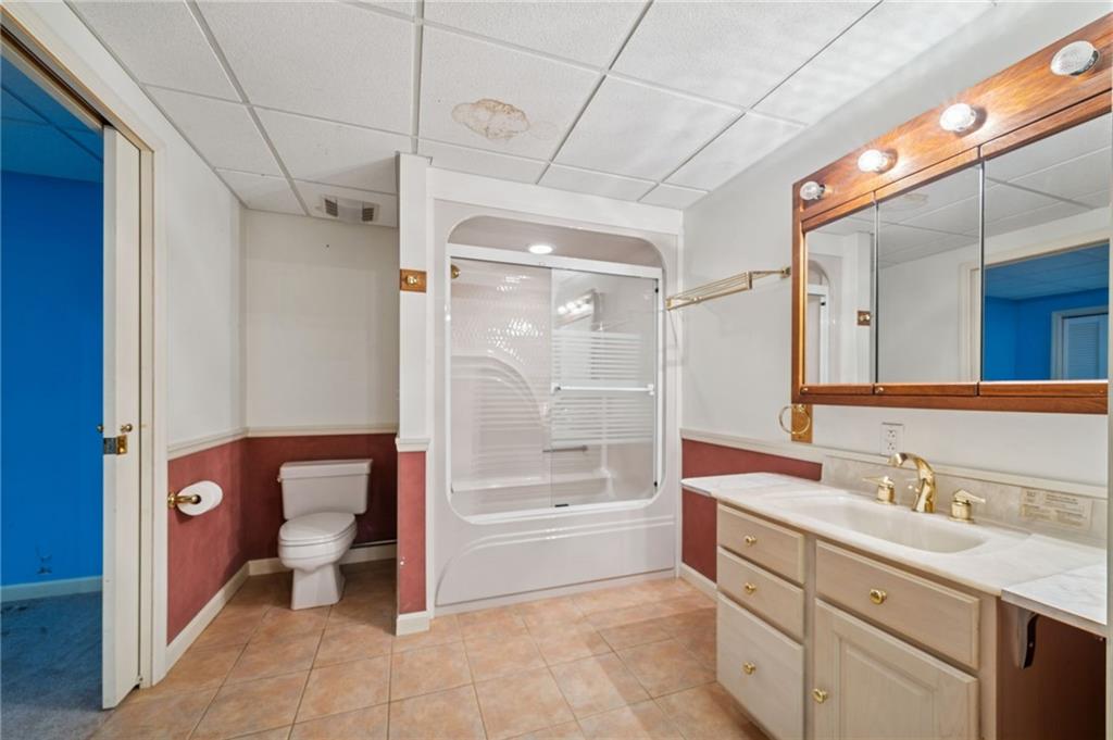 260 Jennie Drive Irwin, PA 15642 - Photo 41 of 49 a bathroom with a granite countertop sink mirror and bathtub