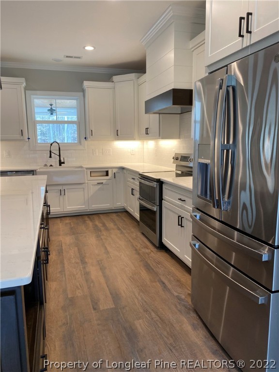 3900 Gainey Road Fayetteville, NC 28306 - Photo 5 of 9 a kitchen with a refrigerator and a sink