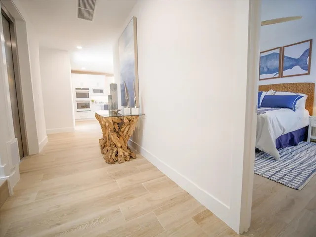 a view of a swimming pool with dining room