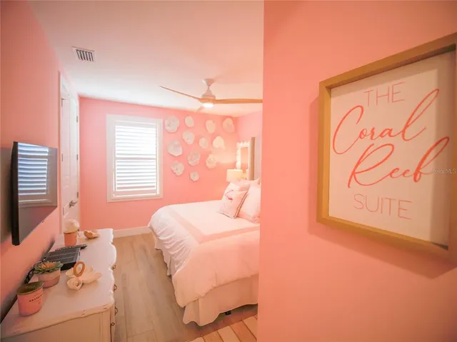 a bedroom with a bed and white walls