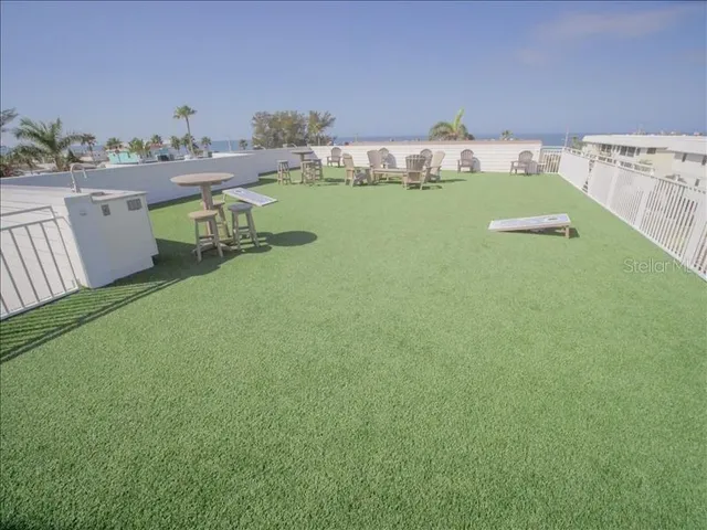 an aerial view of a house with outdoor space
