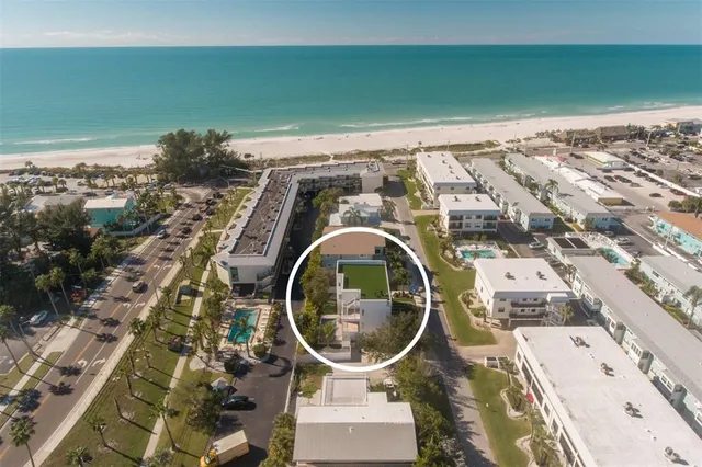 an aerial view of a house with a garden space