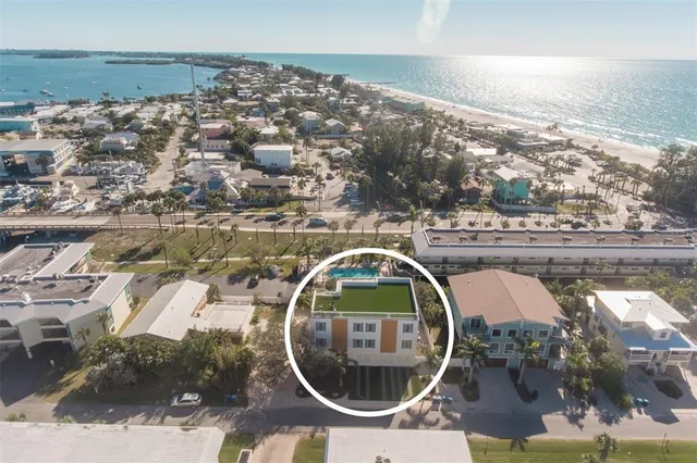 an aerial view of a house with swimming pool