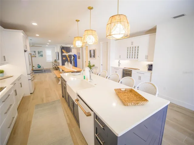 a very nice looking room with a large white bed