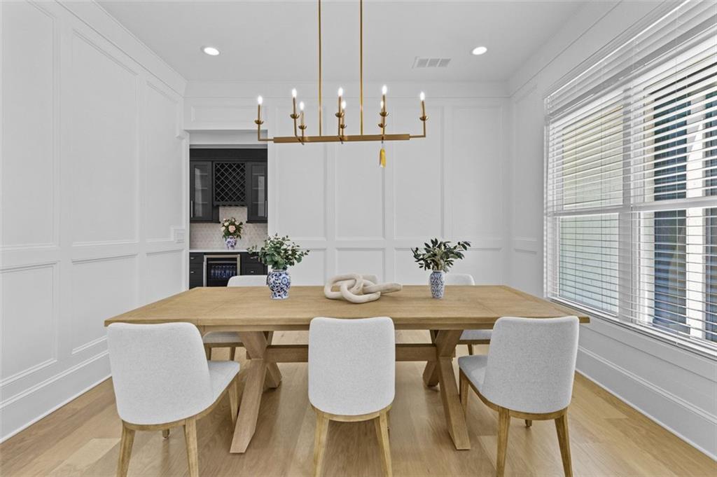 5 Olevia Street Winder, GA 30680 - Photo 11 of 106 a view of a dining room with furniture and wooden floor