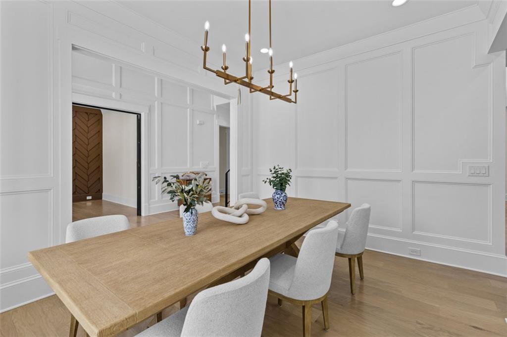 5 Olevia Street Winder, GA 30680 - Photo 13 of 106 a view of a dining room with furniture and wooden floor