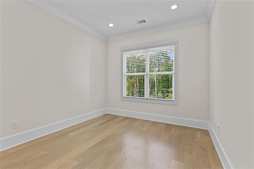 5 Olevia Street Winder, GA 30680 - Photo 39 of 106 an empty room with wooden floor and windows