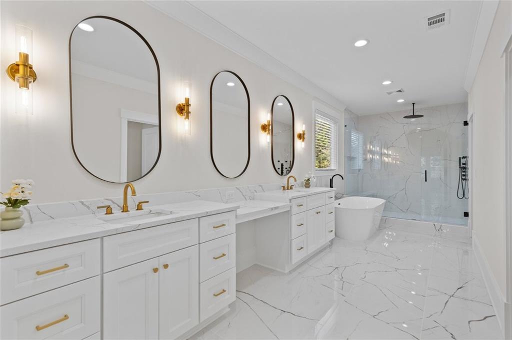 5 Olevia Street Winder, GA 30680 - Photo 46 of 106 a spacious bathroom with a double vanity sink a mirror and a shower