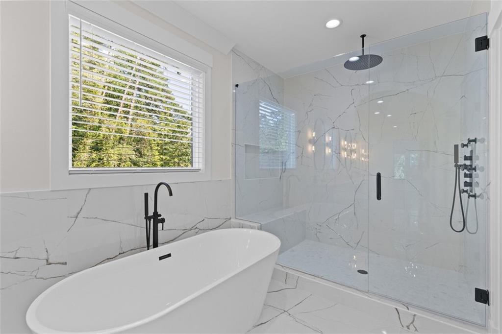 5 Olevia Street Winder, GA 30680 - Photo 47 of 106 a bathroom with a sink a toilet and shower