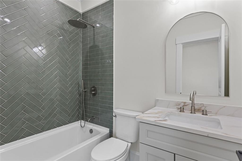 5 Olevia Street Winder, GA 30680 - Photo 54 of 106 a bathroom with a granite countertop sink toilet and shower