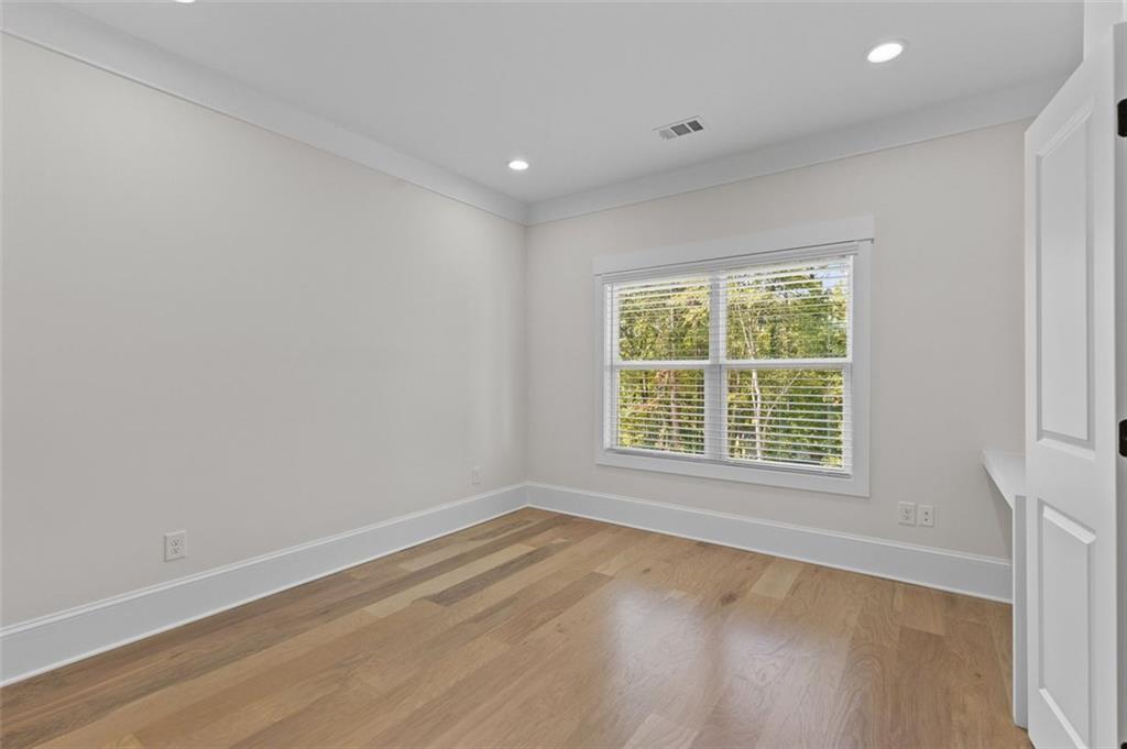 5 Olevia Street Winder, GA 30680 - Photo 60 of 106 an empty room with wooden floor and windows