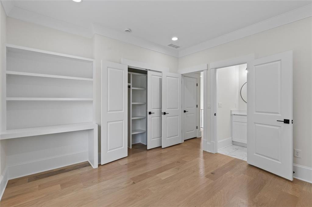 5 Olevia Street Winder, GA 30680 - Photo 61 of 106 a view of an empty room with wooden floor and closet area