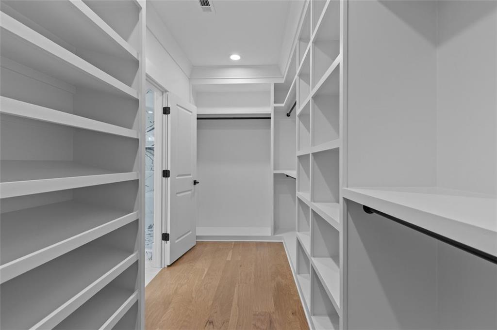 5 Olevia Street Winder, GA 30680 - Photo 73 of 106 a view of walk in closet with empty racks