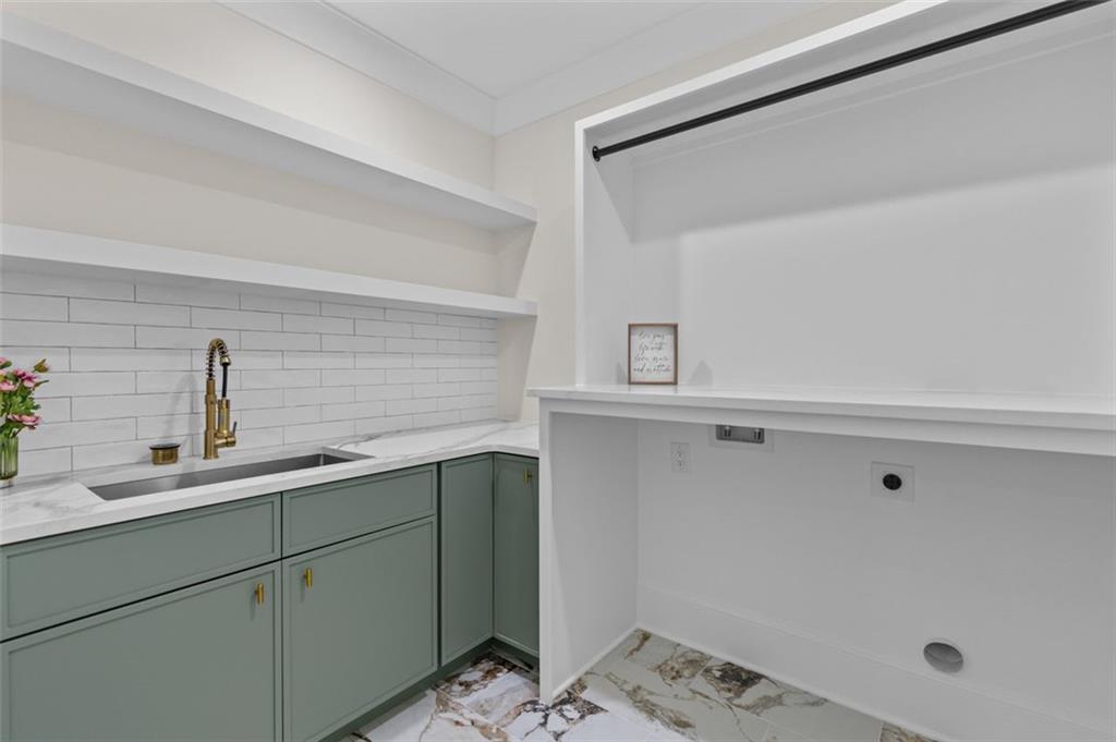 5 Olevia Street Winder, GA 30680 - Photo 77 of 106 a view of a kitchen with a sink and wooden floor