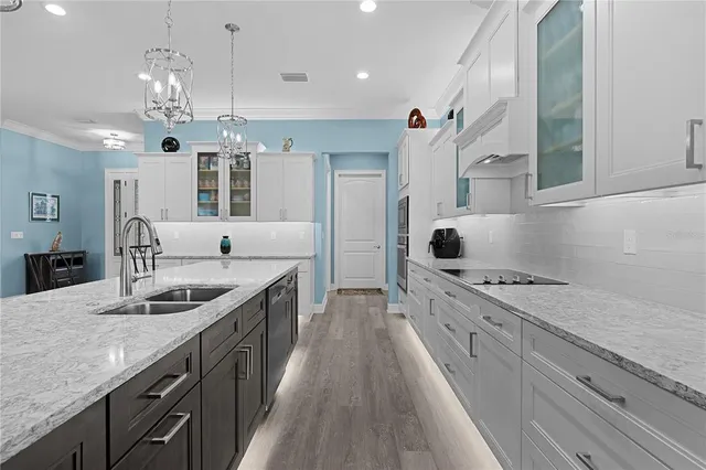 a view of a patio with table and chairs potted plants and a potted plant