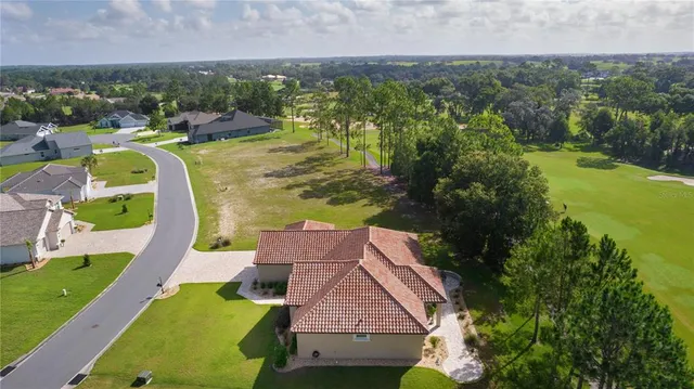 a room with lots of different furniture and flowers