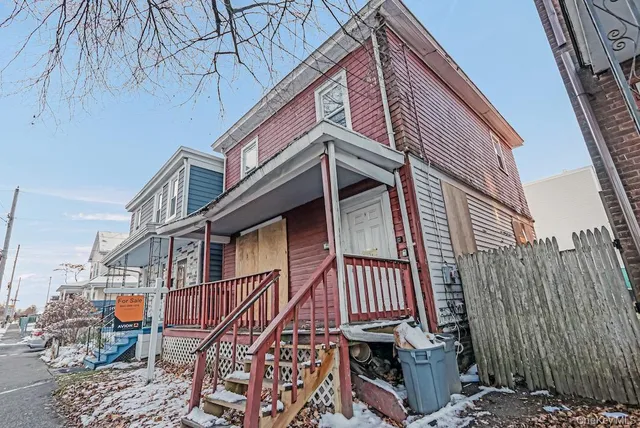a view of a wooden house with a large windows