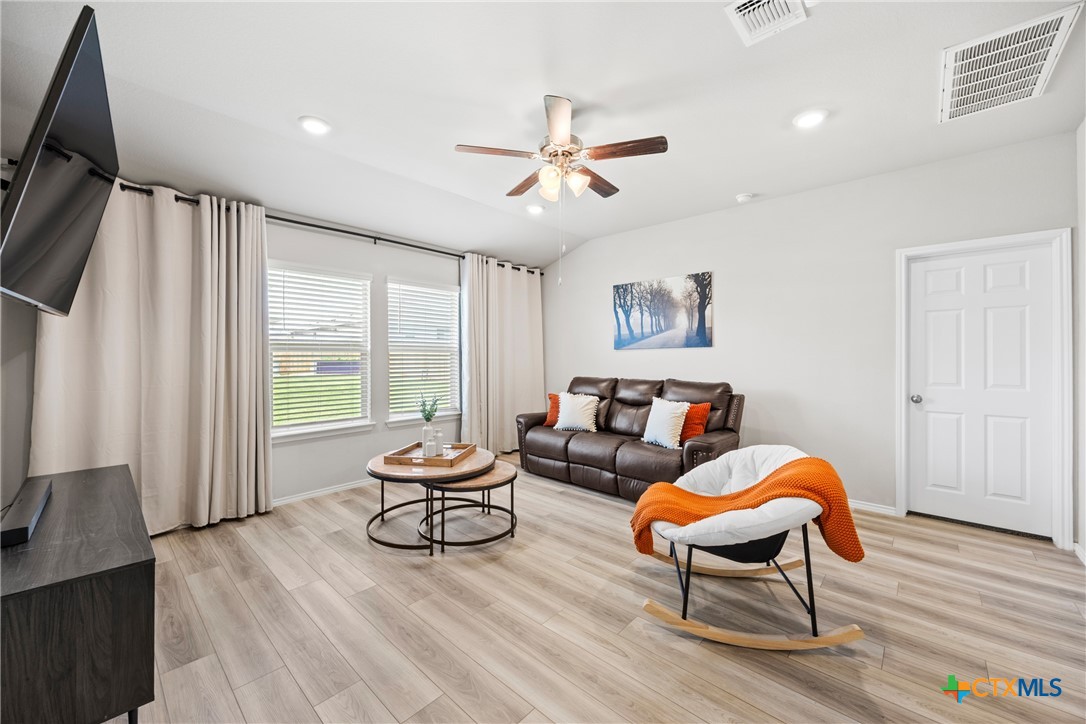 8903 Cantera Rdg Road Temple, TX 76502 - Photo 11 of 25 a living room with furniture a ceiling fan and a window