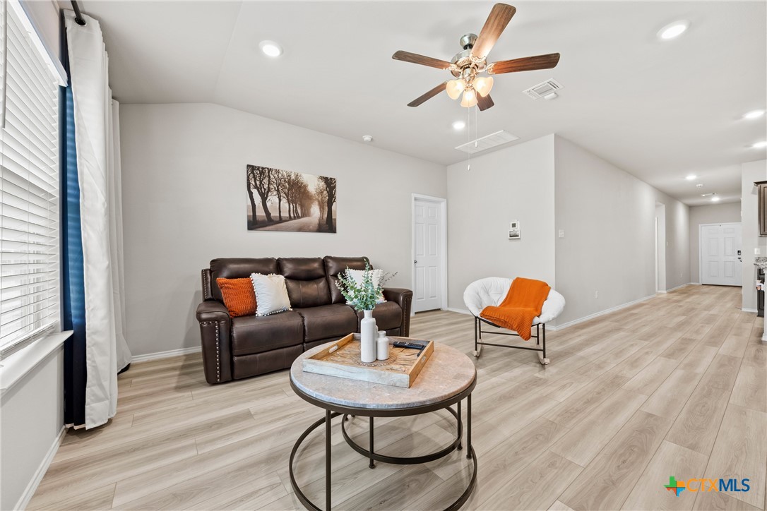8903 Cantera Rdg Road Temple, TX 76502 - Photo 12 of 25 a living room with furniture and a wooden floor