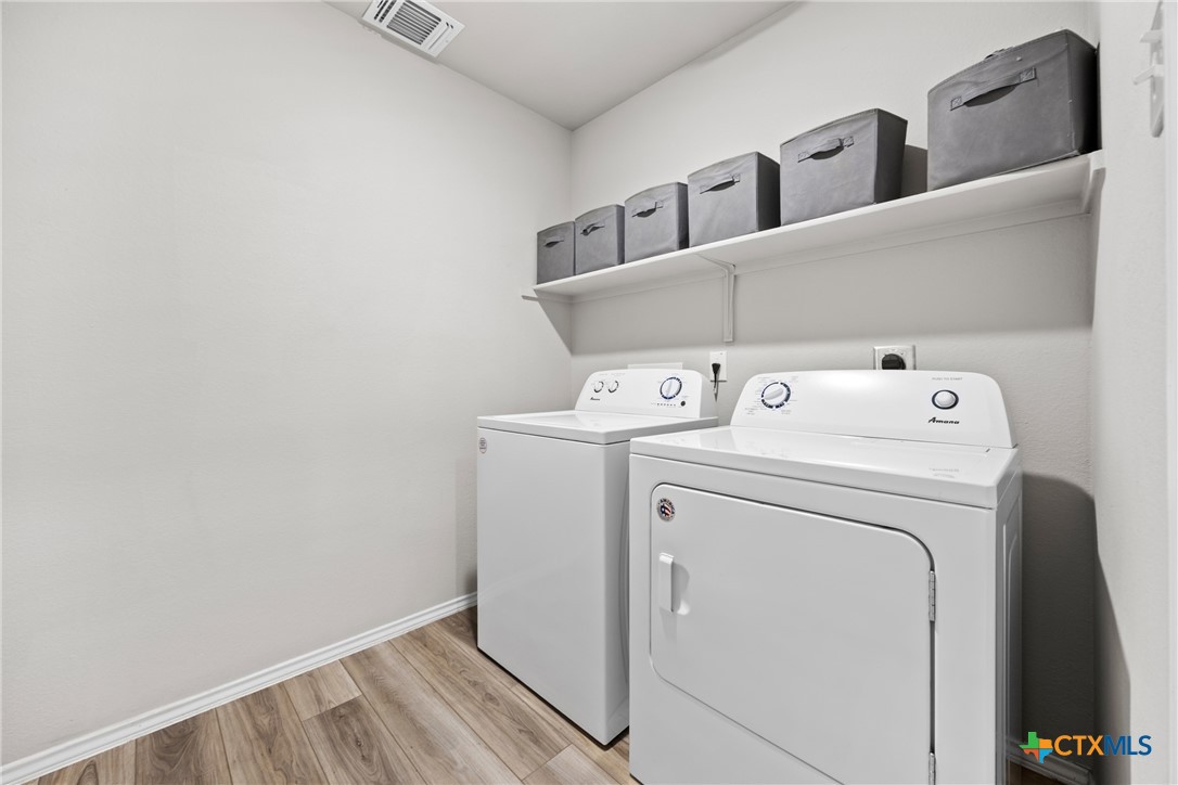 8903 Cantera Rdg Road Temple, TX 76502 - Photo 17 of 25 a utility room with dryer and washer