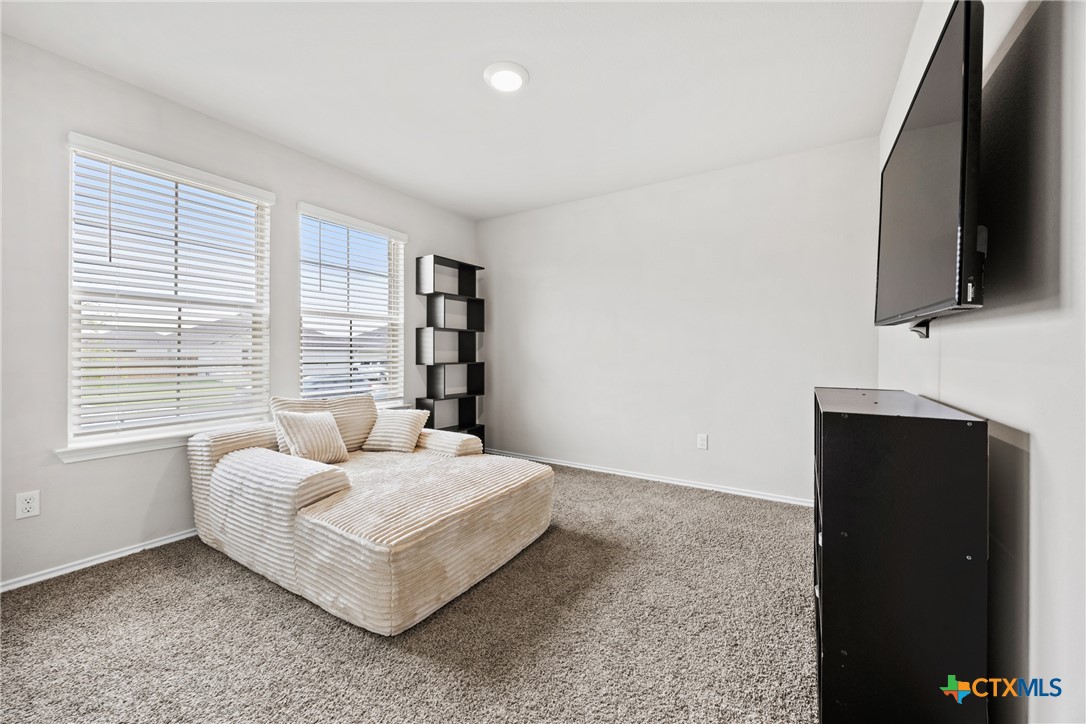 8903 Cantera Rdg Road Temple, TX 76502 - Photo 18 of 25 a living room with furniture and a flat screen tv