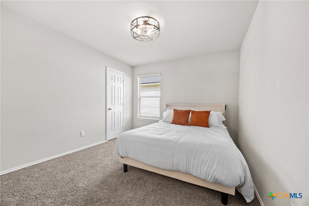 8903 Cantera Rdg Road Temple, TX 76502 - Photo 21 of 25 a bedroom with a bed and a window