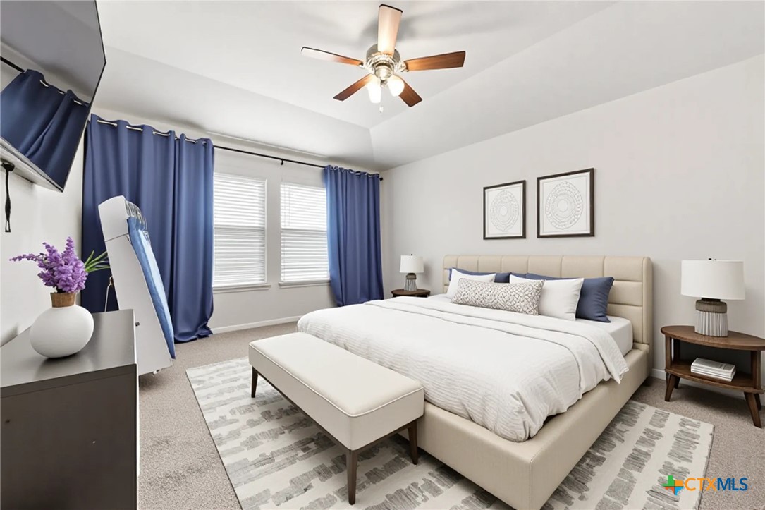 8903 Cantera Rdg Road Temple, TX 76502 - Photo 8 of 25 a bedroom with a bed a large window and potted plant