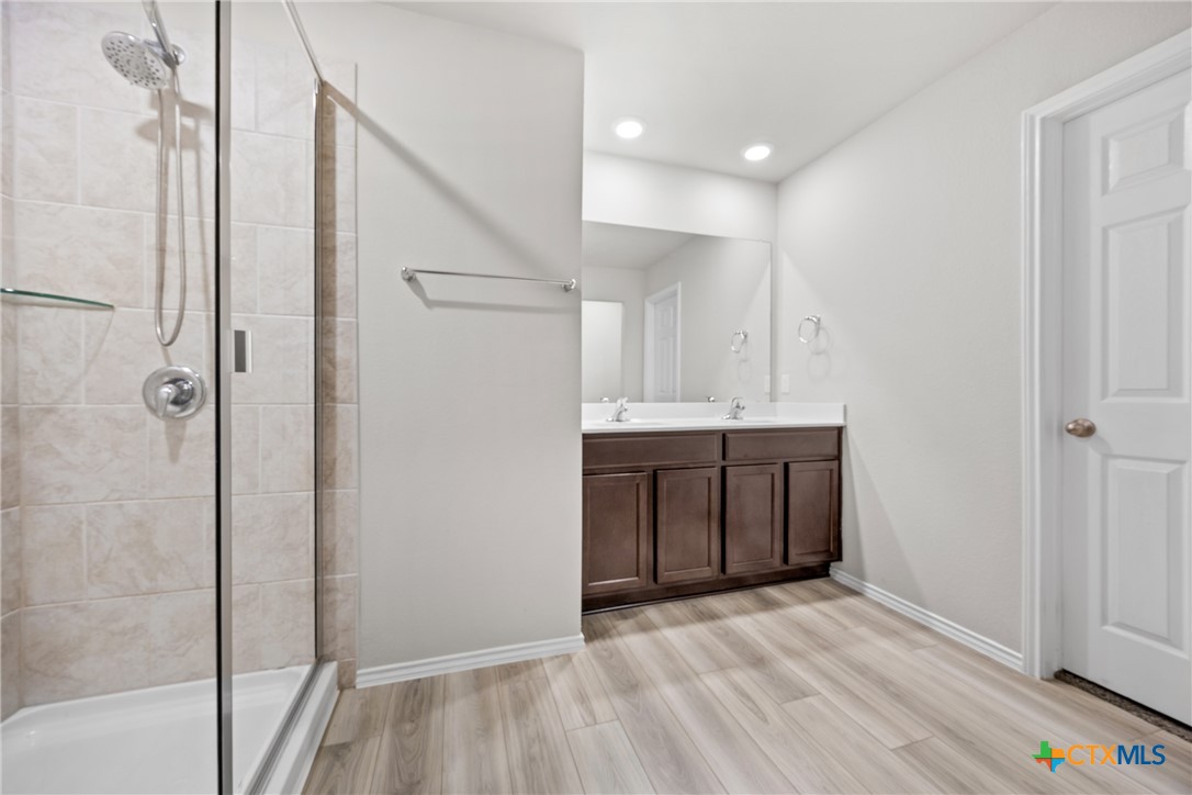 8903 Cantera Rdg Road Temple, TX 76502 - Photo 9 of 25 a bathroom with a sink and a mirror