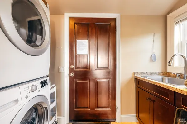 a view of a kitchen with washer and dryer