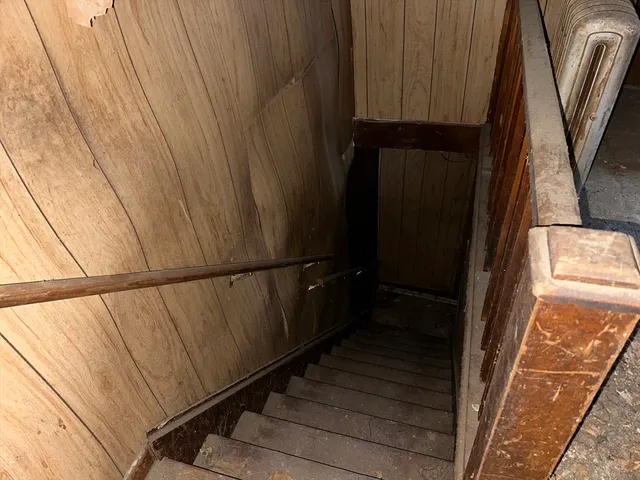 a view of balcony with wooden floor